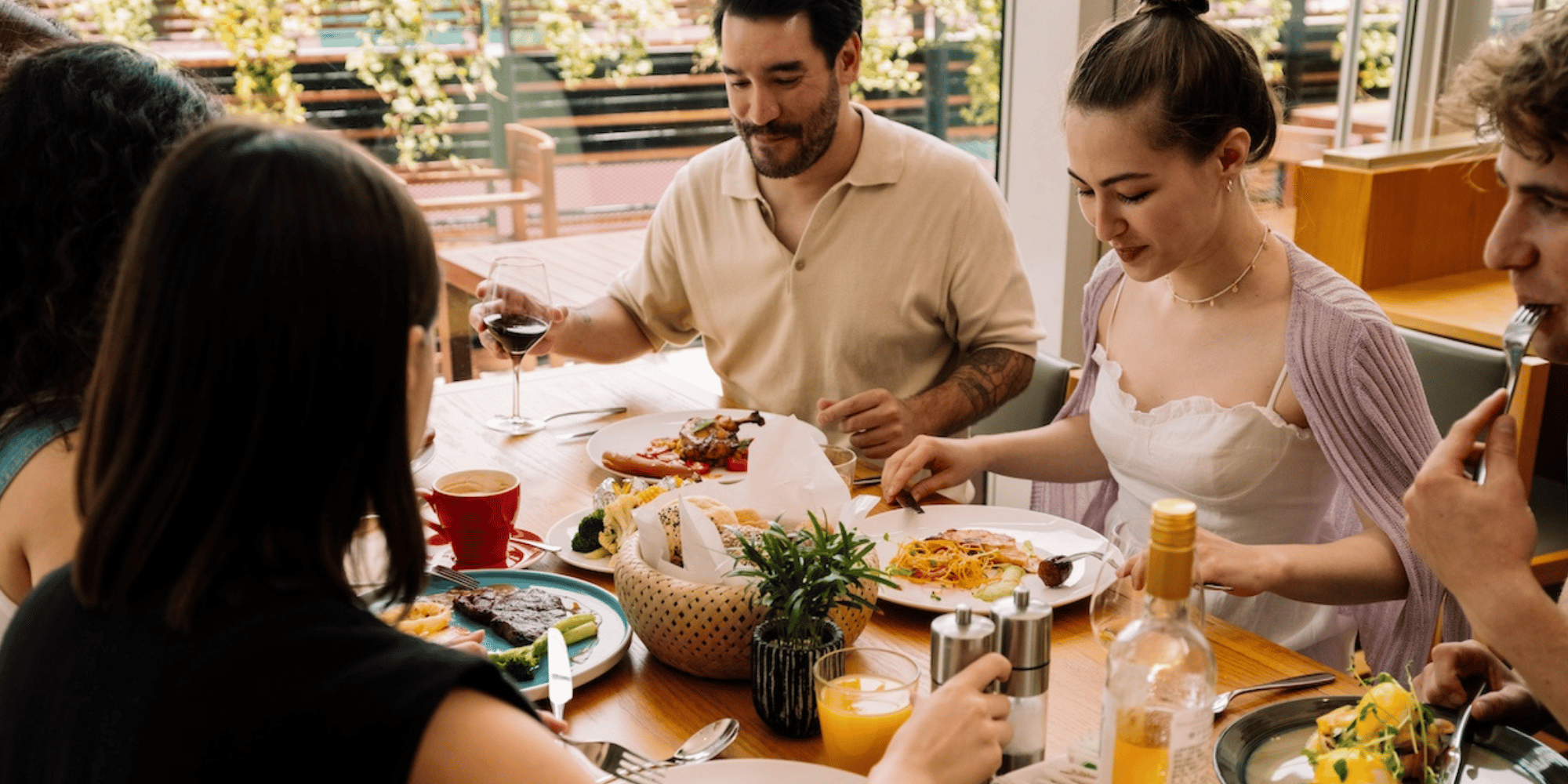 Friends gathering at FEAST to enjoy brunch